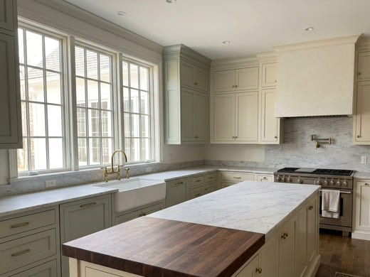 Kitchen on a visit check: countertops clear, sink and faucet dry, nothing left running.
